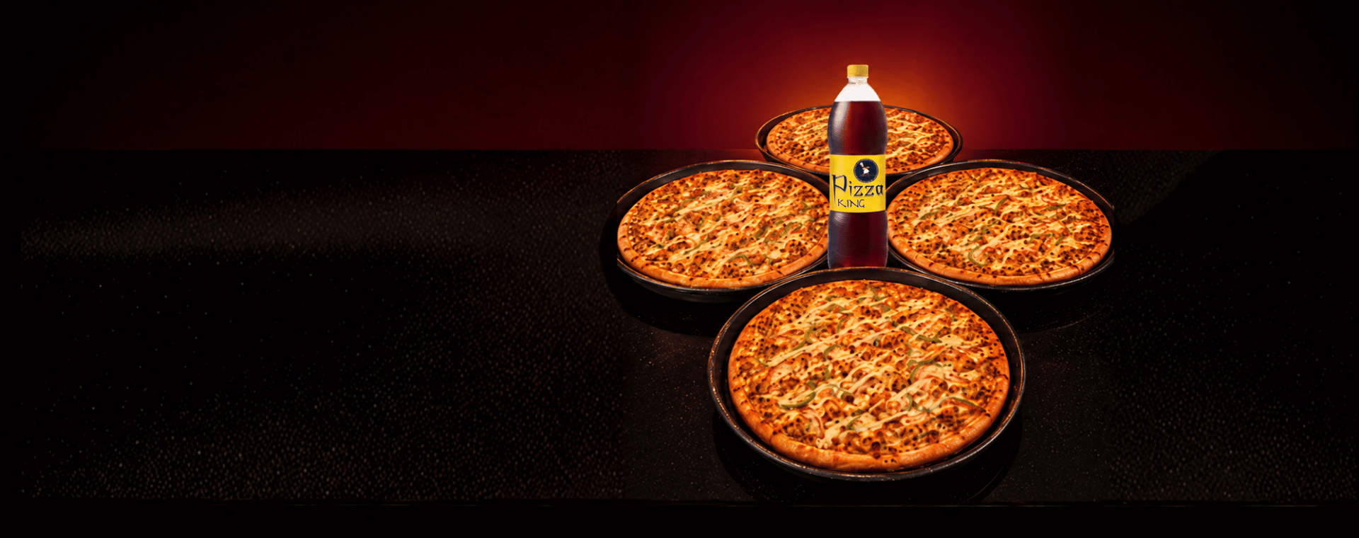 Four large Pizza King pizzas with a jumbo drink